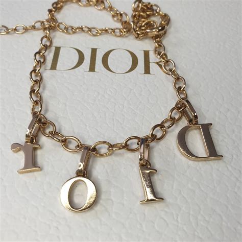 dior necklace gold letters.